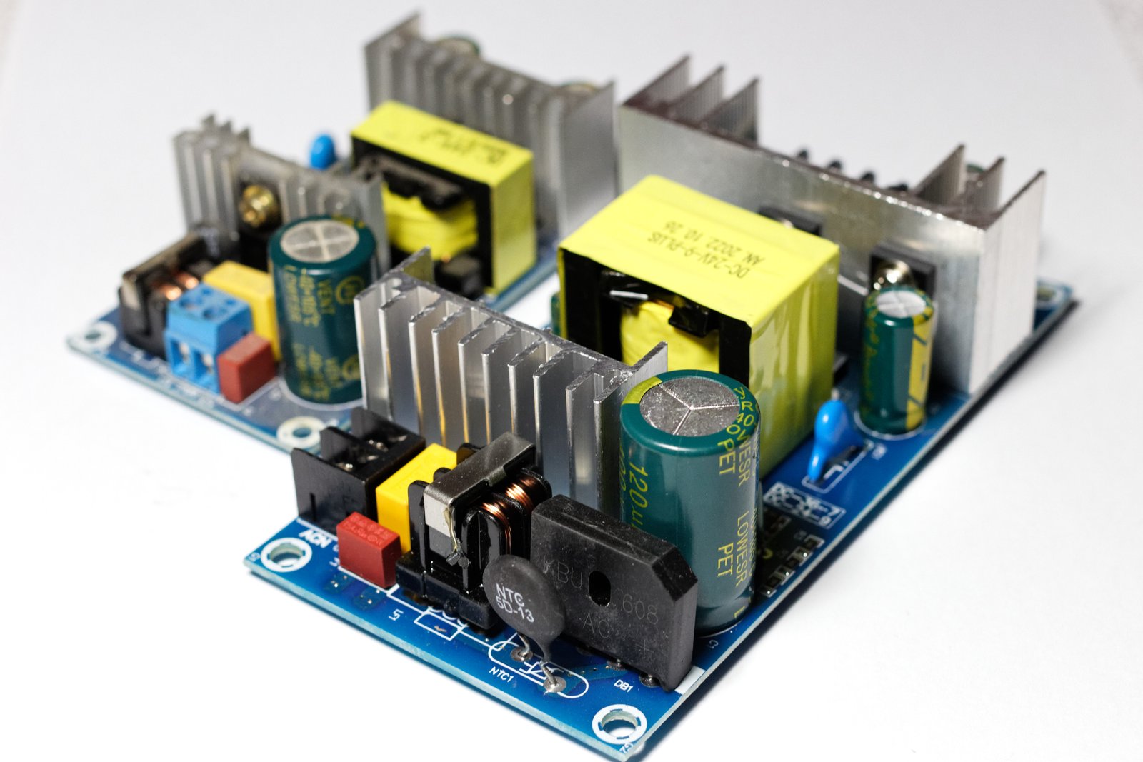 Two open-frame AC-DC SMPS boards for 24 V output testing