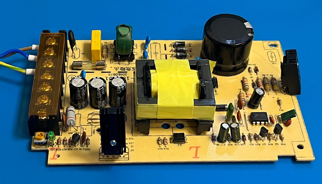 Secondary side of a switch-mode power supply PCB with transformer and output capacitors