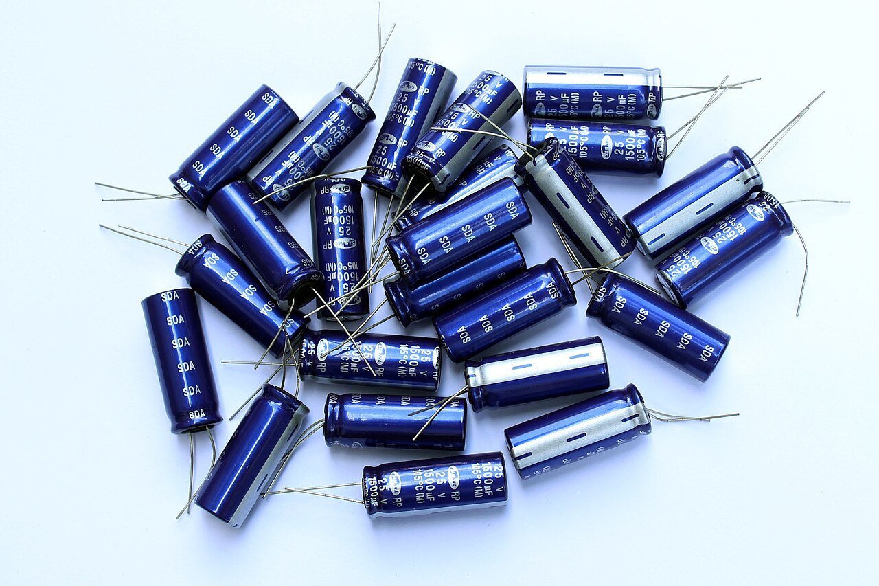 Clean group of radial electrolytic capacitors like those commonly replaced on switching power supply outputs
