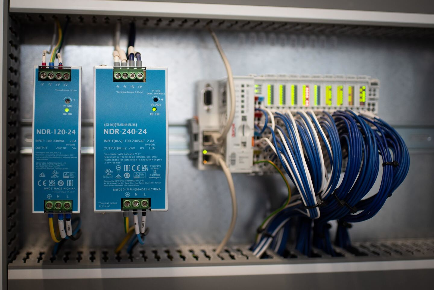 DIN-rail switching power supplies installed in an automation control cabinet
