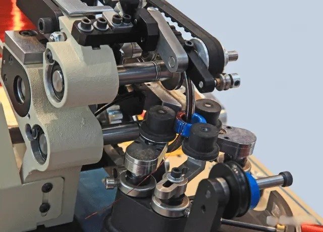 Close-up of an automatic transformer coil winding process